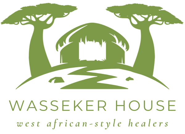An African hut in between two baobab trees